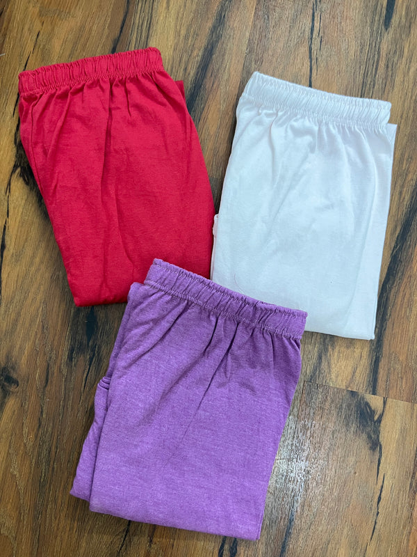 Pack of three plain cotton jersey trousers ( purple - red - white)