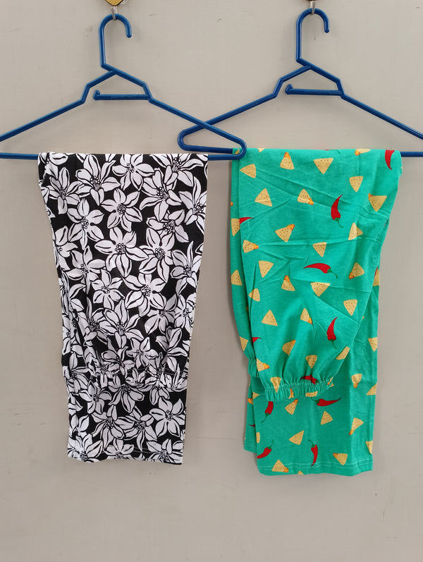 Pack of two cotton jersey trousers (black flowers - green crackers)